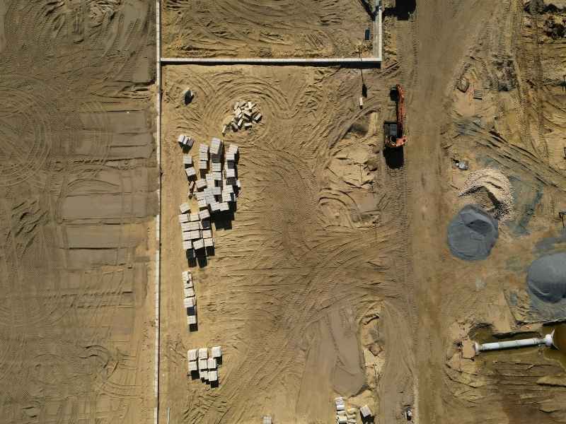 Drone Surveying Large Construction Site Warner Robins Georgia | Warner Robins Land Surveying Drone surveying aerial view of a large construction site in Warner Robins,Georgia